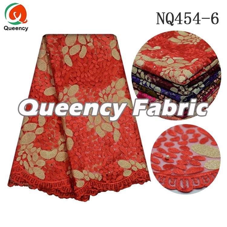 TULLE EMBROIDERY IN CORAL TULLE EMBROIDERY IN CORAL