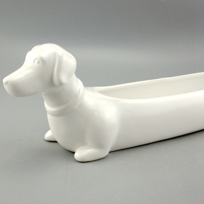 white ceramic dachshund planter