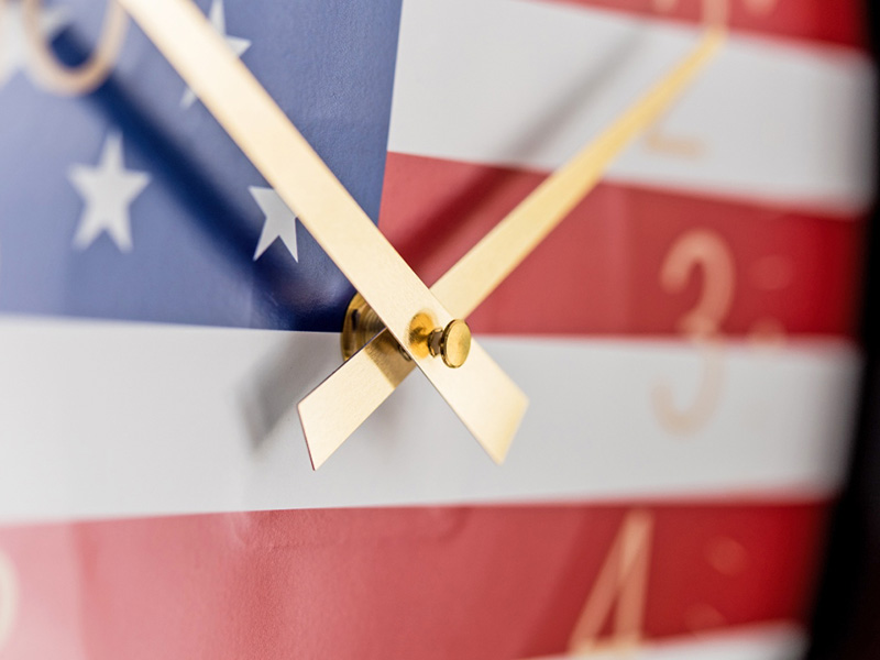 USA patriotic clock with golden clock hands USA patriotic clock with golden clock hands