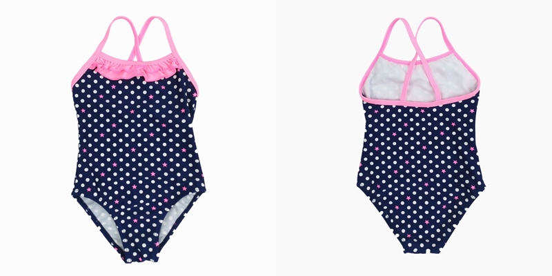 Girl's one piece bathing suit with ruffle and all over print, back cross-over straps Girl's one piece bathing suit with ruffle and all over print, back cross-over straps