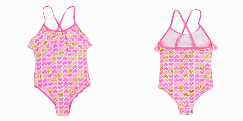 Girl's one-piece bathing suit with ruffle, and cross-over straps