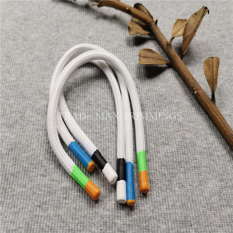 Round plastic drawcord with double color dipping tip