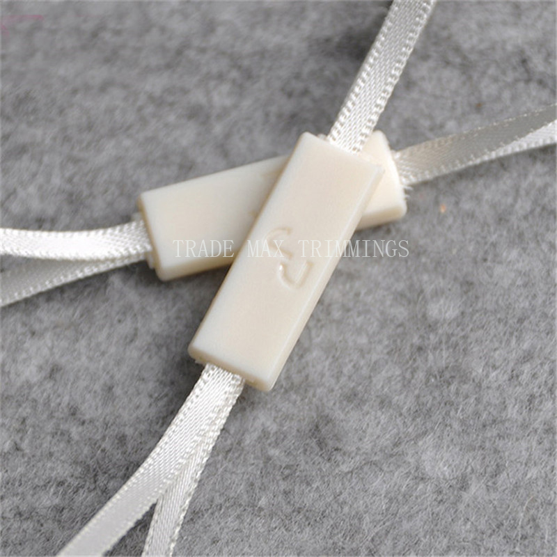 fashion latest dress ribbon designs plastic seal tag 