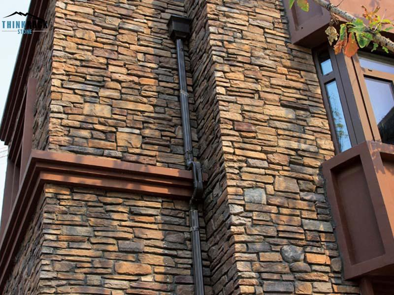 Faux stone panels for cladding systems