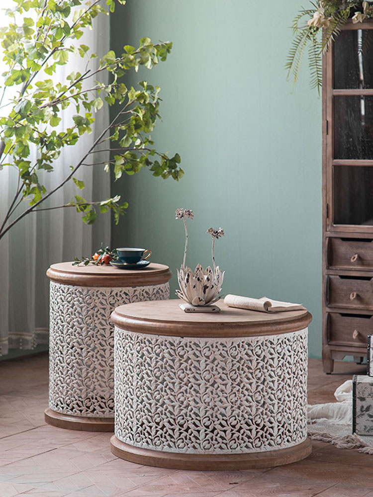 carved round side table