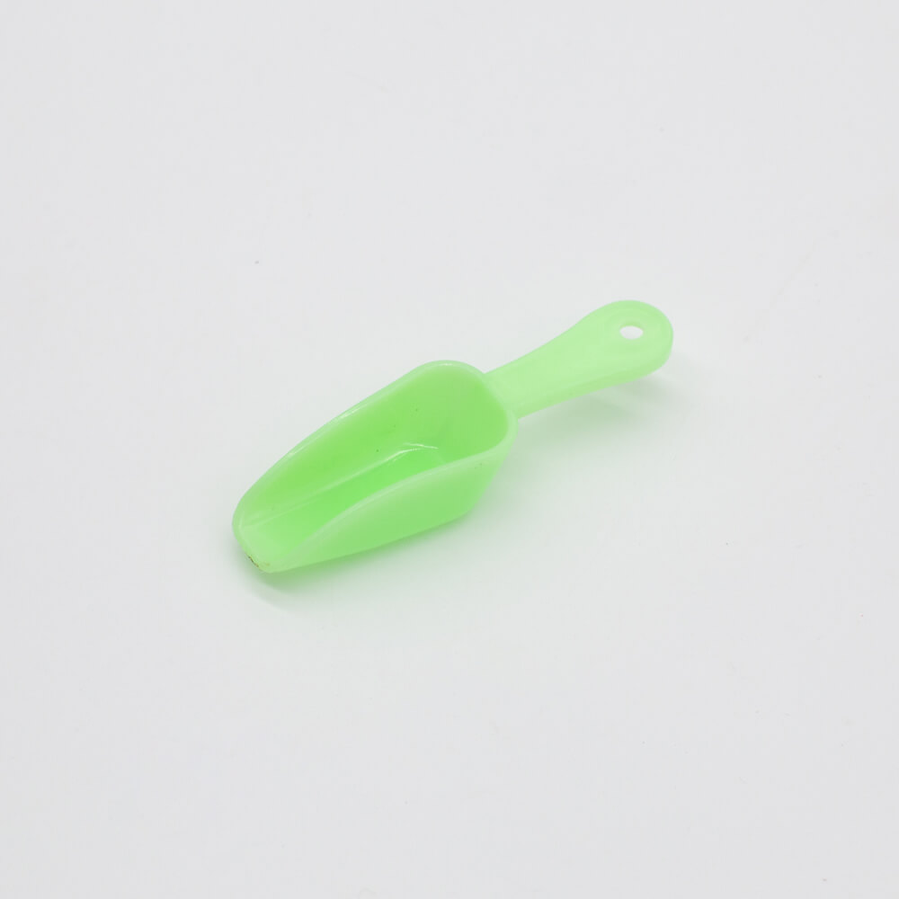 green mini plastic spoon