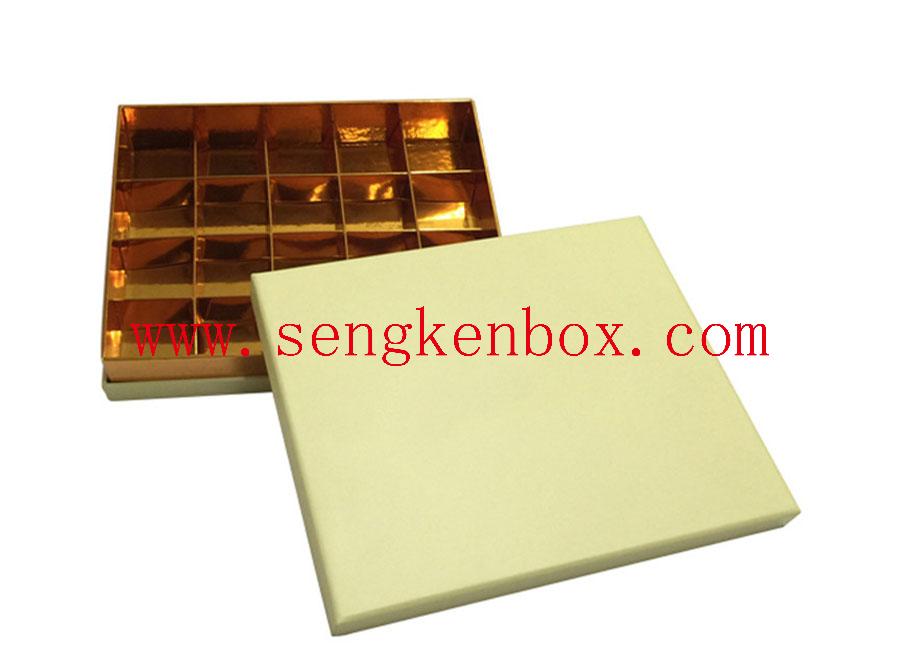 Chocolate Separates Inside Golden Foldable Box Chocolate Separates Inside Golden Foldable Box