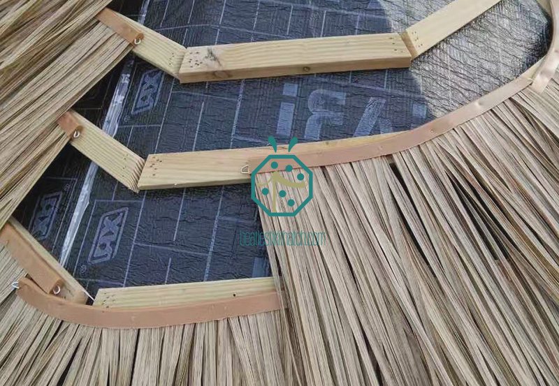 Installation of synthetic makuti umbrella thatch roofing