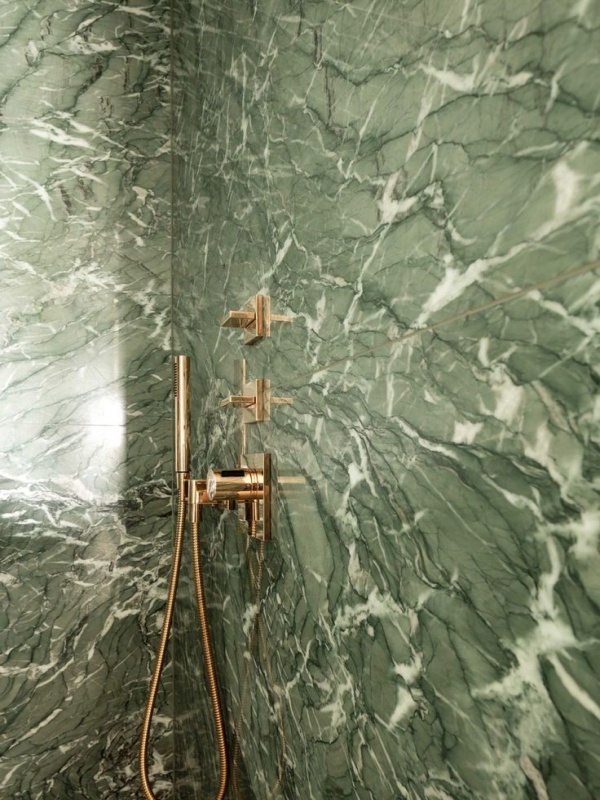 Verde Antigua marble bathroom walls